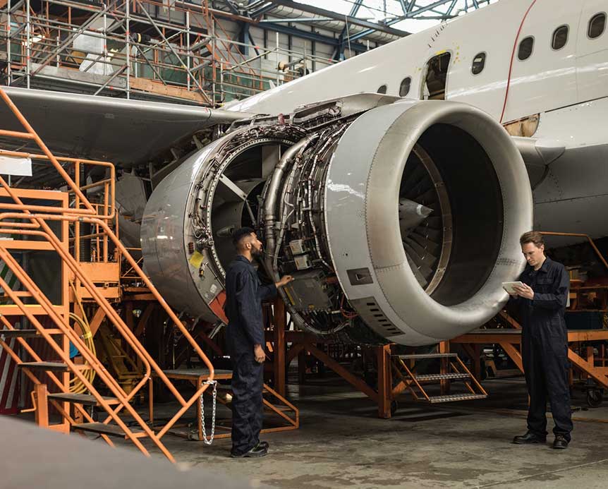 FMEA workers near an airplane engine